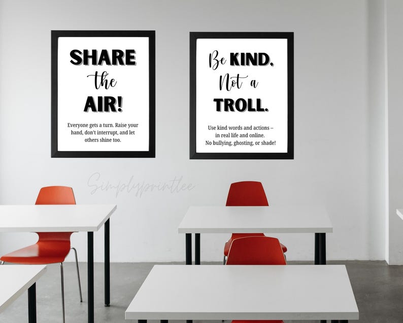 May include: Two framed posters with black frames and white backgrounds. One poster reads "SHARE the AIR!" and the other says "Be KIND. Not a TROLL." The posters are in a classroom setting with white desks and red chairs.