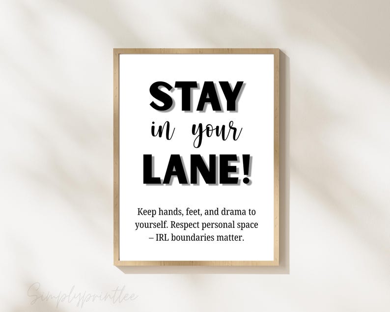 May include: A framed print with the words "STAY in your LANE!" in bold black letters. Below, smaller text reads, "Keep hands, feet, and drama to yourself. Respect personal space - IRL boundaries matter."