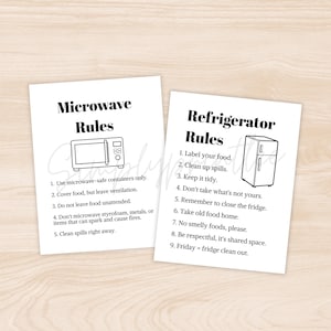 May include: Two white cards with black text and illustrations. One card reads "Microwave Rules" with a microwave graphic and safety instructions. The other card says "Refrigerator Rules" with a fridge graphic and guidelines for food storage.