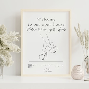 May include: A black and white sign with the text "Welcome to our open house Please remove your shoes" and a line drawing of a woman's legs and feet in high heels. The sign also includes a QR code and the text "Scan for more info on this property. Your Logo."