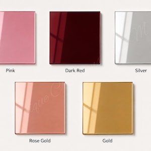 May include: Five square, glossy, reflective panels arranged in a grid. The colors are pink, dark red, silver, rose gold, and gold. Each panel features a smooth, polished surface with a distinct light reflection, labeled with its respective color name.
