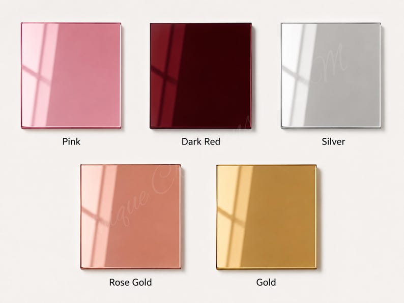 May include: Five square, glossy, reflective panels arranged in a grid. The colors are pink, dark red, silver, rose gold, and gold. Each panel features a smooth, polished surface with a distinct light reflection, labeled with its respective color name.