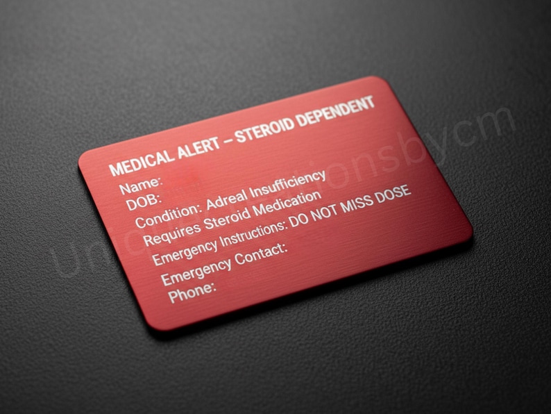 May include: A red medical alert card with white text. The card reads "MEDICAL ALERT - STEROID DEPENDENT" and includes fields for name, DOB, condition, emergency instructions, and contact information. The condition listed is Adreal Insufficiency.