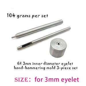 May include: A 3-piece silver metal hand-hammering mold set for 6# 3mm inner diameter eyelets. The set includes two long cylindrical tools and one circular base piece. The text 104 grams per set, 6# 3mm inner diameter eyelet hand-hammering mold 3-piece set, and SIZE: for 3mm eyelet are visible.