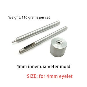 May include: A silver-colored metal tool set for 4mm eyelets, including two long cylindrical rods and one circular base mold. The text reads: Weight: 110 grams per set, 4mm inner diameter mold, and SIZE: for 4mm eyelet.