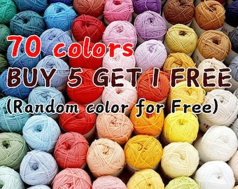 May include: A colourful array of yarn balls in shades of blue, red, pink, and yellow. The image includes text: "70 colours, BUY 5 GET 1 FREE (Random colour for Free)". Suitable for knitting and crochet crafts.