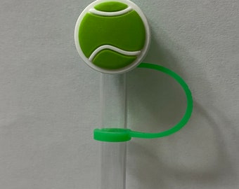 May include: A clear plastic drinking straw with a green tennis ball-shaped top and a green silicone strap.