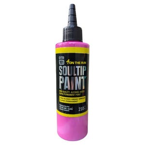 May include: A pink bottle of OTR 901 On The Run Soultip Paint. The bottle is labeled with the brand name, product name, and instructions for use. The paint is alcohol-based and super permanent.