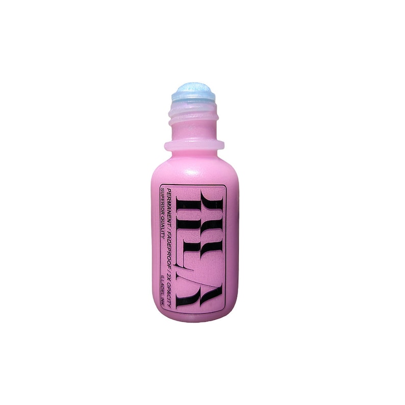 May include: A pink bottle of permanent, fade-proof ink with a blue cap. The bottle is labeled "JUVIA'S PLACE" and "SUPERIOR QUALITY - 2X OPACITY - ILLUMINATE INK".