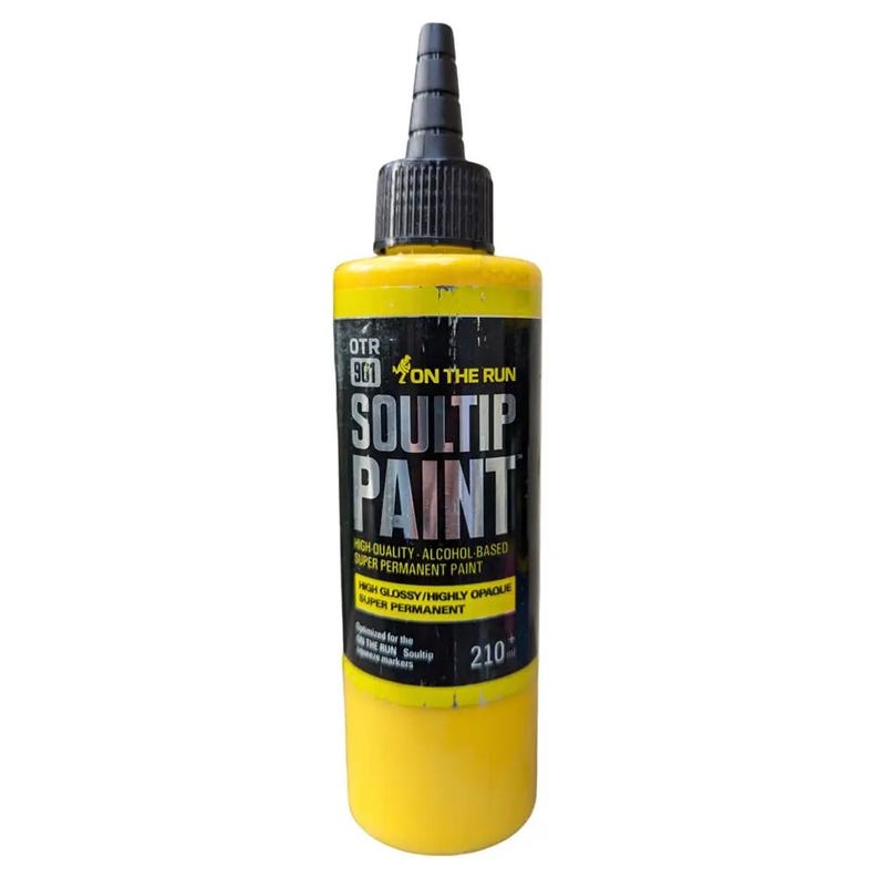 May include: A yellow bottle of Soultip Paint, a high-quality alcohol-based super permanent paint. The bottle has a black cap and label with the text "OTR 801 On The Run Soultip Paint" and "High Quality - Alcohol Based Super Permanent Paint".