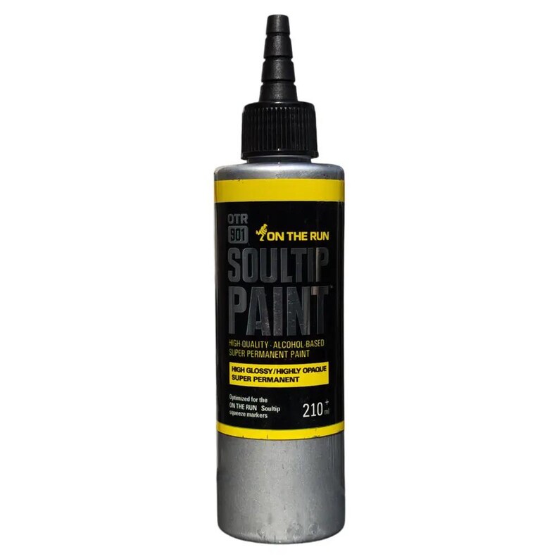 May include: A silver bottle of Soultip Paint, a high-quality alcohol-based super permanent paint. The bottle has a yellow label with black text that reads "OTR 901 ON THE RUN SOULTIP PAINT" and "HIGH QUALITY ALCOHOL BASED SUPER PERMANENT PAINT HIGH GLOSSY/HIGHLY OPAQUE SUPER PERMANENT". The label also includes the text "Optimized for the ON THE RUN Soultip opaque markers" and "210".
