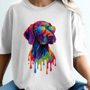 May include: White t-shirt with a vibrant, artistic dog design wearing sunglasses. The dog is depicted in a range of bright colours with a dripping paint effect. This casual t-shirt is a comfortable style, perfect for everyday wear. The design is eye-catching.