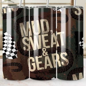 May include: A stainless steel tumbler with a brown and green background featuring tire tracks and the words "MUD, SWEAT & GEARS" in a distressed font. A checkered flag design is on the side.