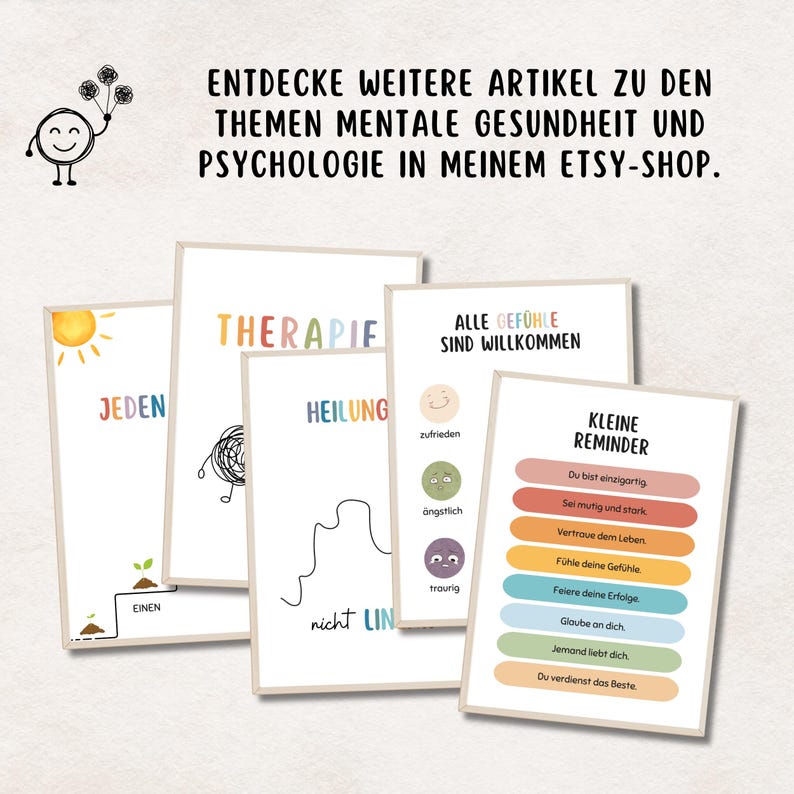 May include: A collection of art prints with mental health themes. The prints feature colorful text and illustrations, including the words "Therapie," "Heilung," and "Kleine Reminder." The prints are displayed on a light background.