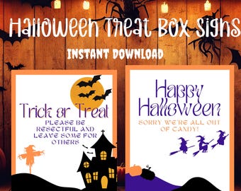 May include: Two printable Halloween treat box signs. The first sign says "Trick or Treat" with a cartoon image of a house and a scarecrow. The second sign says "Happy Halloween" with a cartoon image of three witches flying on broomsticks. Both signs have a purple and orange color scheme.