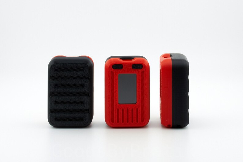 May include: Three red and black devices with a small screen and buttons. The devices are arranged in a row on a white surface.