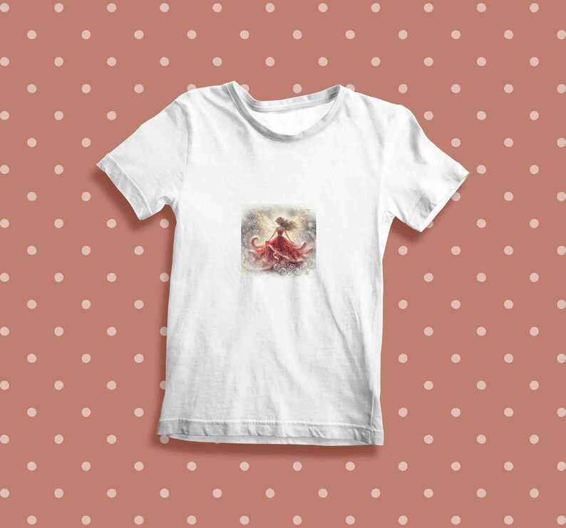 May include: White t-shirt with a watercolor illustration of a woman in a red dress with her arms raised.