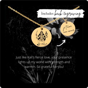 May include: Gold necklace with a round pendant featuring a black and white illustration of the Hindu goddess Kali. The back of the pendant can be engraved with the text "je t'aime mon amour".