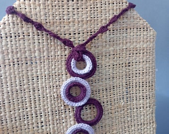 Crochet necklace in purple tones. Hoops pendant