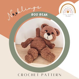 May include: A brown crochet teddy bear with a cream-colored muzzle, black nose, and black eyes. The text Nooklings BOO BEAR and VAN EEDEN CROCHET are visible, along with the words CROCHET PATTERN. The bear has a textured yarn finish.