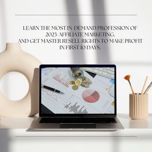 May include: A laptop computer with a white background displaying a spreadsheet with charts and graphs. The laptop is on a white desk with a ceramic vase and a pencil holder containing paintbrushes.