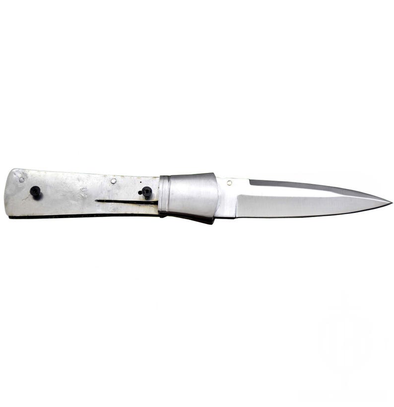 May include: A silver folding knife with a pointed blade. The handle is a light silver color with two black rivets. The blade is a shiny silver color. The knife is open and ready for use.