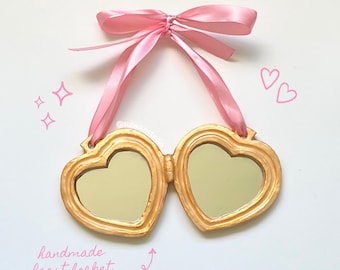 clay heart locket mirror, coquette gold pink satin bow wall hanging, cute girly whimsical decor, handmade lovecore kawaii dreamy pastel home