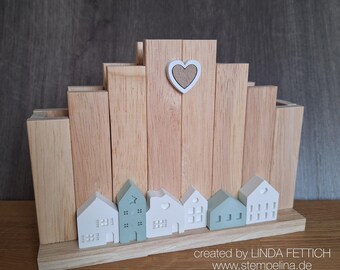 Napkin holder with a row of little houses - light oak wood - houses in white and grey-green