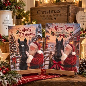 May include: Two rectangular canvas prints featuring Santa Claus in a red suit petting a black horse. The left print says Merry Christmas, and the right print says Merry Xmas and a Happy New Year. Both show snowy winter scenes with trees.