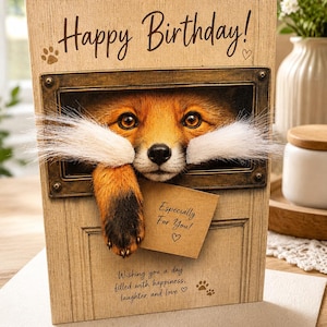 May include: A rectangular birthday greeting card with a wood-grain texture featuring a fox peering through a rectangular window. The card displays the text Happy Birthday, Especially For You, and Wishing you a day filled with happiness, laughter and love.