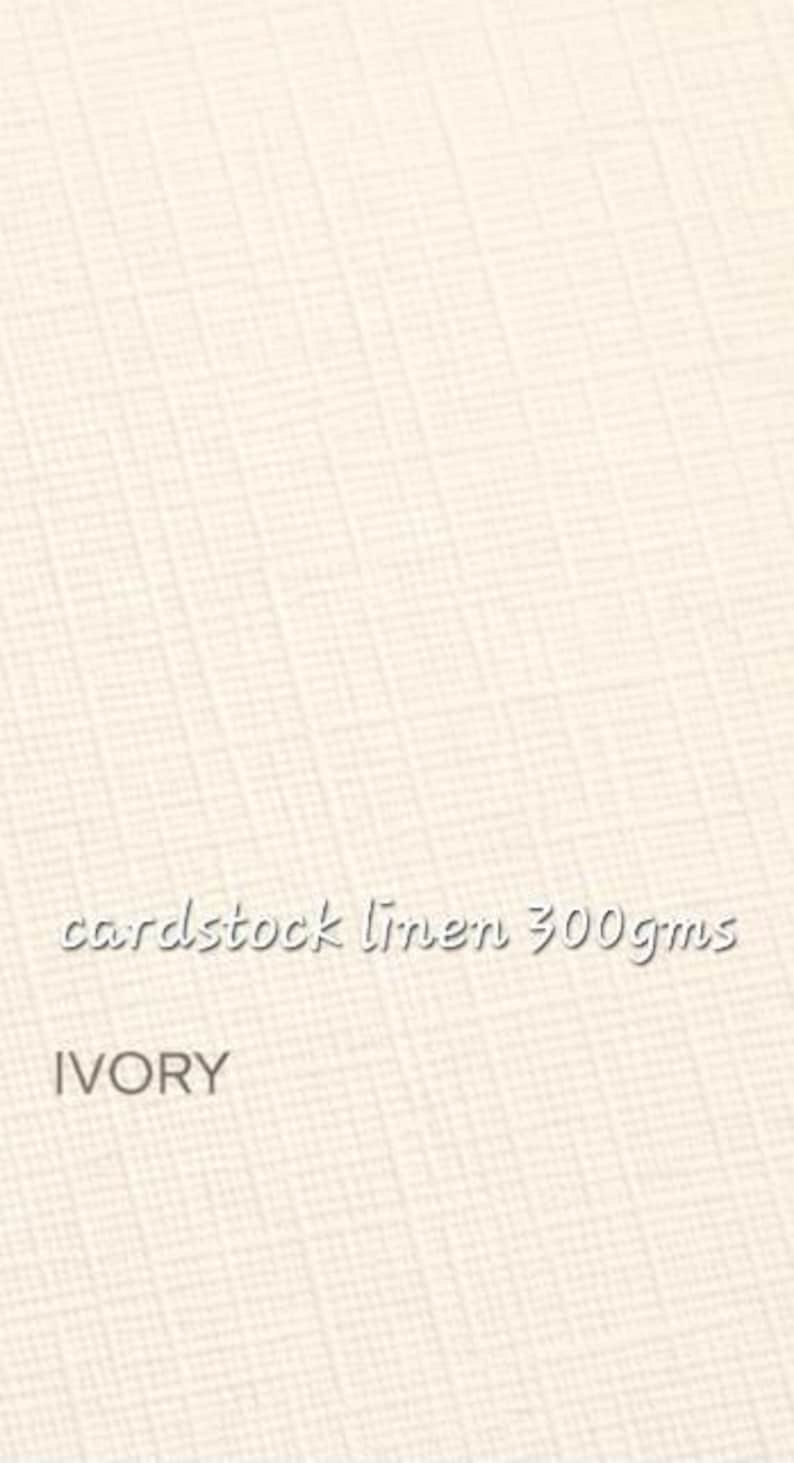 May include: An ivory colored cardstock with a visible linen texture. The surface features a cross-hatched pattern. Printed text on the cardstock reads: cardstock linen 300gms and IVORY. The material has a weight specification of 300gms.