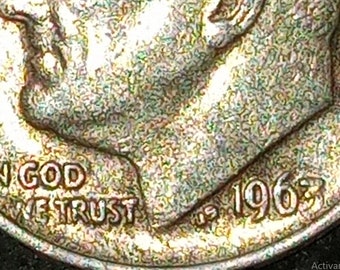Collectible silver coin with printing error incorrectly printed numbers and letters