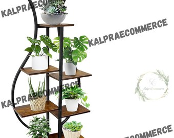 May include: A black metal plant stand with five wooden shelves. The stand has a curved design and is decorated with plants in pots.