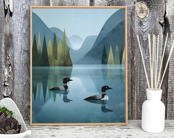 Modern Loon Lake Art Print with Minimalist Forest and Mountain Landscape in Cool Blue Tones for Nature Lovers and Cabin Wall Decor