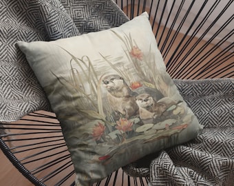 May include: A decorative throw pillow with a nature-inspired design featuring two otters in a pond with lily pads and flowers. The pillow has a light green background with brown, green, and white accents.
