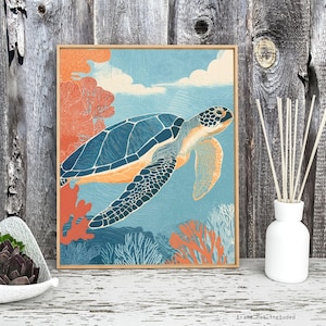 May include: A framed art print featuring a sea turtle swimming in an ocean scene. The turtle has a blue shell and orange flippers. Coral and other sea plants are in the background. The print is in a wooden frame.