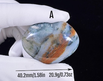 May include: A heart-shaped polished stone labeled A, featuring a mix of blue, green, and orange-brown inclusions. The stone measures 1.58 inches in length and weighs 0.73 ounces, as indicated by the text printed on the image.