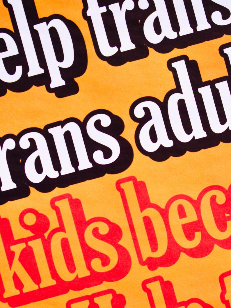 May include: Orange background with black and white text that reads "Help trans adults" and red text that reads "kids become"