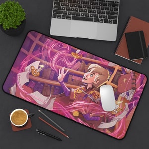 May include: A pink and purple mousepad with a cartoon illustration of a person in a library surrounded by books and magical pink swirls. The person is holding a book and looking up at a glowing orb.