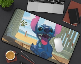 May include: A blue and pink cartoon character with a big smile and tongue sticking out. The character is sitting on a wooden surface with a beach scene in the background. The character is wearing a blue collar with a white bow tie.