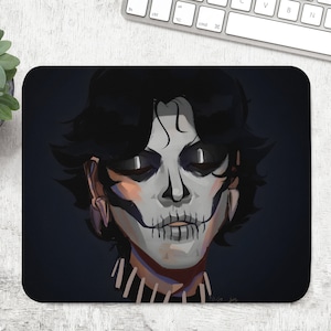 May include: A black and white illustration of a person with dark hair wearing a skull makeup. The person is looking directly at the viewer. The background is dark blue.
