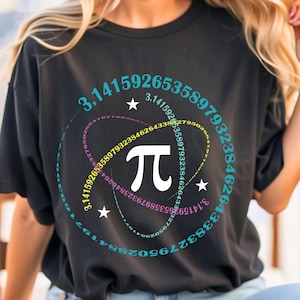 May include: Black t-shirt with a graphic of the mathematical constant pi, surrounded by a circle of numbers. The numbers are in a repeating pattern, forming a spiral.