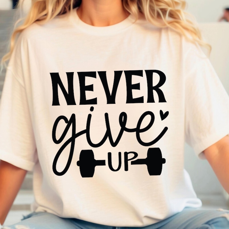 May include: White t-shirt with black text that reads "NEVER give UP" with a dumbbell graphic.