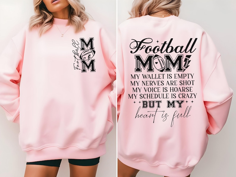 May include: Pink sweatshirt with a black graphic that says "Football Mom" and includes a football design. The text below the graphic says "My wallet is empty, my nerves are shot, my voice is hoarse, my schedule is crazy, but my heart is full."