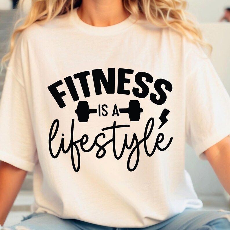 May include: White t-shirt with black text that reads "Fitness is a lifestyle" with a dumbbell graphic.