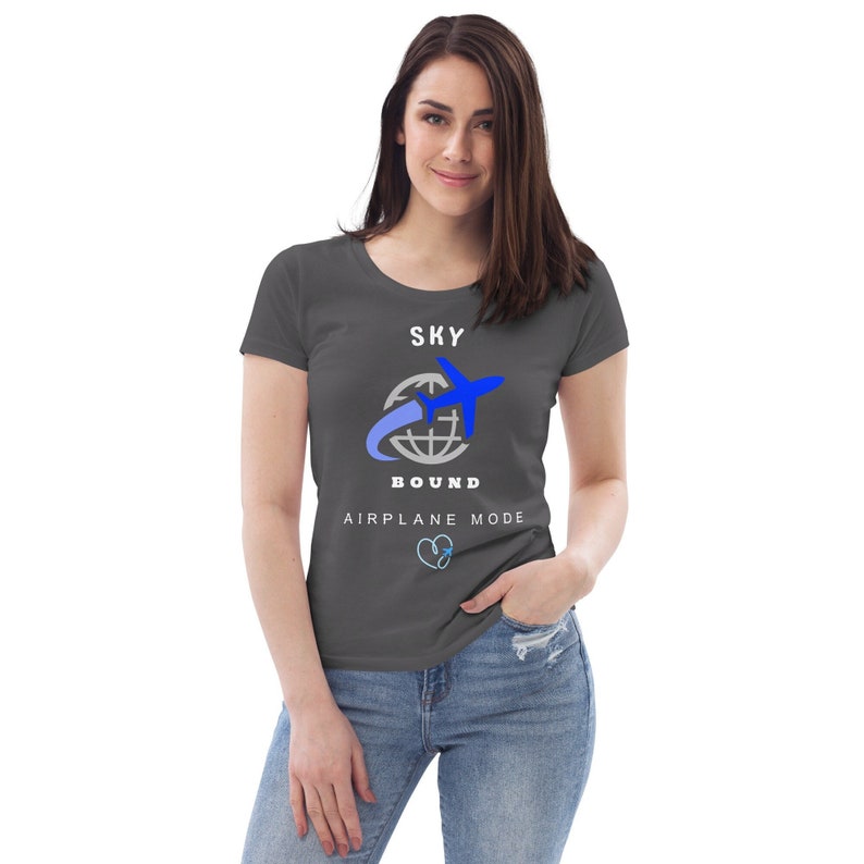 May include: A charcoal grey t-shirt with a white graphic of a blue airplane flying around a globe. The text "SKY BOUND" is below the graphic and the text "AIRPLANE MODE" is below that.