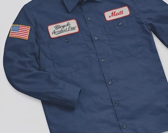 Maglietta da meccanico personalizzata a maniche lunghe blu con toppa ricamata della bandiera USA.