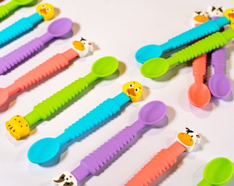 Set of 2, 3-in-1 Silicone Baby Spoons. Animal head 3-in-1 colorful baby spoons. Made from 100% food-grade Silicone. Feeds, Teeth, motivates.