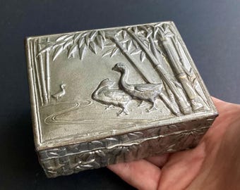Chinese Repousse Silvered Pewter Yuanyang Box,  Early 20th Century