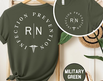May include: A green t-shirt with the text "Infection Prevention RN" in a circle with a caduceus symbol. The shirt is available in military green.